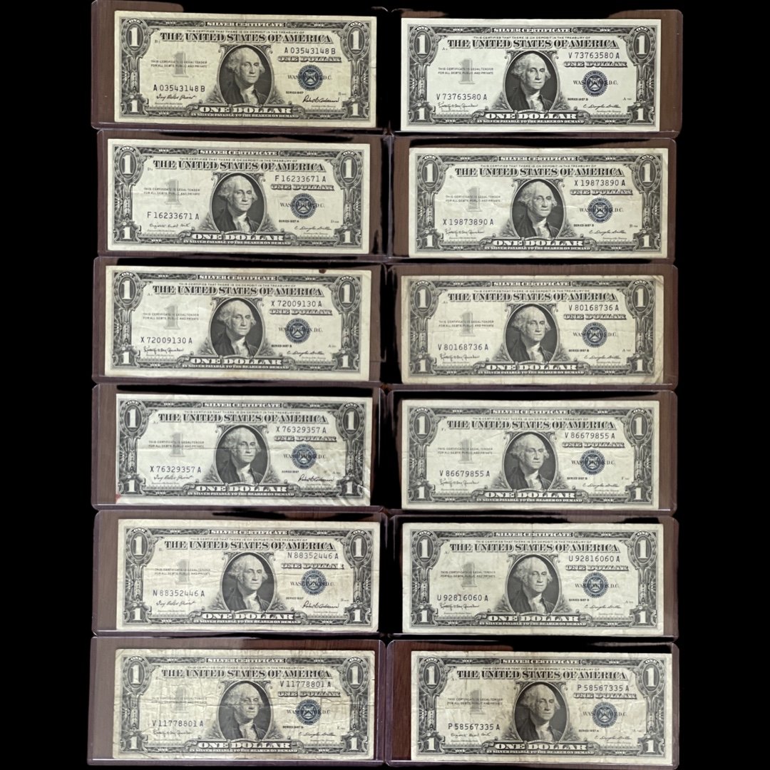12 Total 1957 Series Silver Dollar Certificates: 12 Total 1957 Series Silver Dollar Certificates, fair to excellent condition, repeating serial numbers on some, a collector's dream!