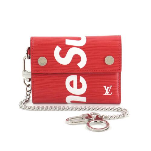 Authentic LOUIS VUITTON Supreme Epi Chain Compact: This item qualifies for FREE DOMESTIC SHIPPING to customers in the USA Brand: Louis Vuitton Size H: 3.74 Inch Style: Wallet Size D: 0.59 Inch Material: Epi Leather Weight: 0.39 Lb Color: Red White Pro