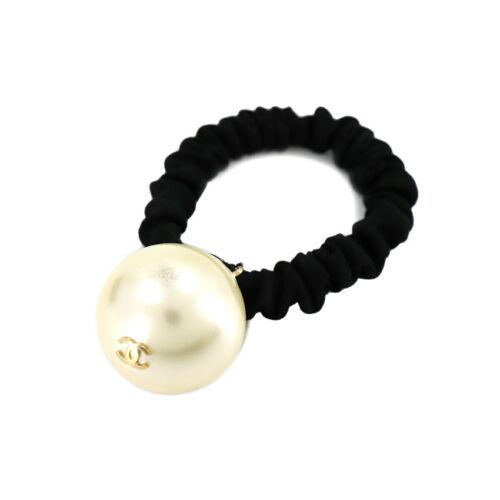 Authentic CHANEL Coco Logos Hair tie White Gold Black: This item qualifies for FREE DOMESTIC SHIPPING to customers in the USA Brand: Chanel Weight: 0.7Oz Style: Hair Tie Engraved: F15V Color: White Gold Black Type: Hair Tie Country: France Frame Color: Ã