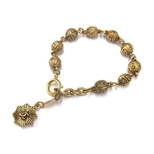 Authentic CHANEL Coco Logos Bracelet 1985 Gold Vintage: This item qualifies for FREE DOMESTIC SHIPPING to customers in the USA Brand: Chanel Weight: 1.08Oz Style: Bracelet Engraved: 1985 Color: Gold Type: Bracelet Country: France Frame Color: Ã¯¼�