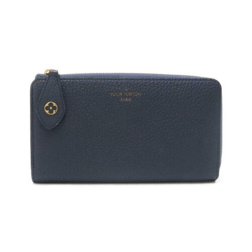 Authentic LOUIS VUITTON Taurillon Wallet M68582: This item qualifies for FREE DOMESTIC SHIPPING to customers in the USA Brand: Louis Vuitton Size: W X H X Gusset (W) : 19.5Cm X 11Cm X 2.5Cm Style: Purse Mpn: M68582 Color: Bleu Marine / Gold Parts Ty