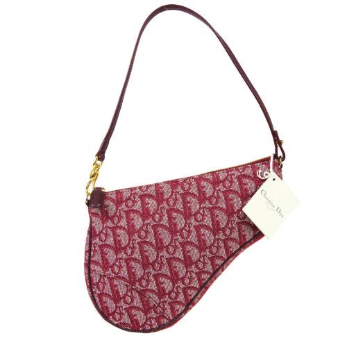 Authentic Christian Dior Trotter Saddle Hand Bag Pouch: This item qualifies for FREE DOMESTIC SHIPPING to customers in the USA Size: Small Pattern: Trotter Character: Pouch Features: Detachable Strap Accents: Logo Color: Bordeaux Model: Saddle Bag MPN: Doe