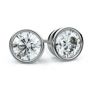 Platinum Bezel Set Round Brilliant Diamond Stud: This item qualifies for FREE DOMESTIC SHIPPING to customers in the USA These Enchanting Diamond Stud Earrings Come Set In Platinum Metal With A Bezel Setting And Breathtaking Round Diamonds With A