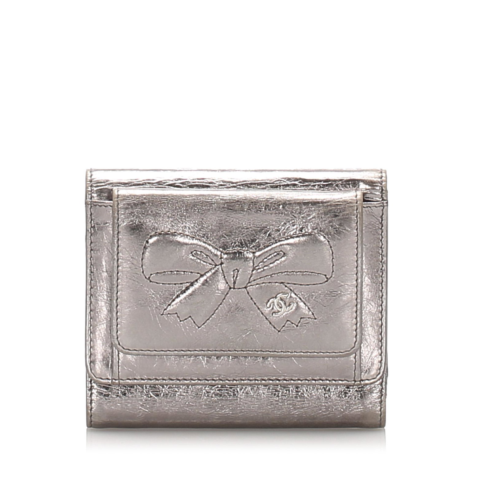 Authentic Chanel CC Bow Leather Wallet: This item qualifies for FREE DOMESTIC SHIPPING to customers in the USA This wallet features metallic leather body an exterior slip pocket a front flap with snap button closure and interior slip pocket