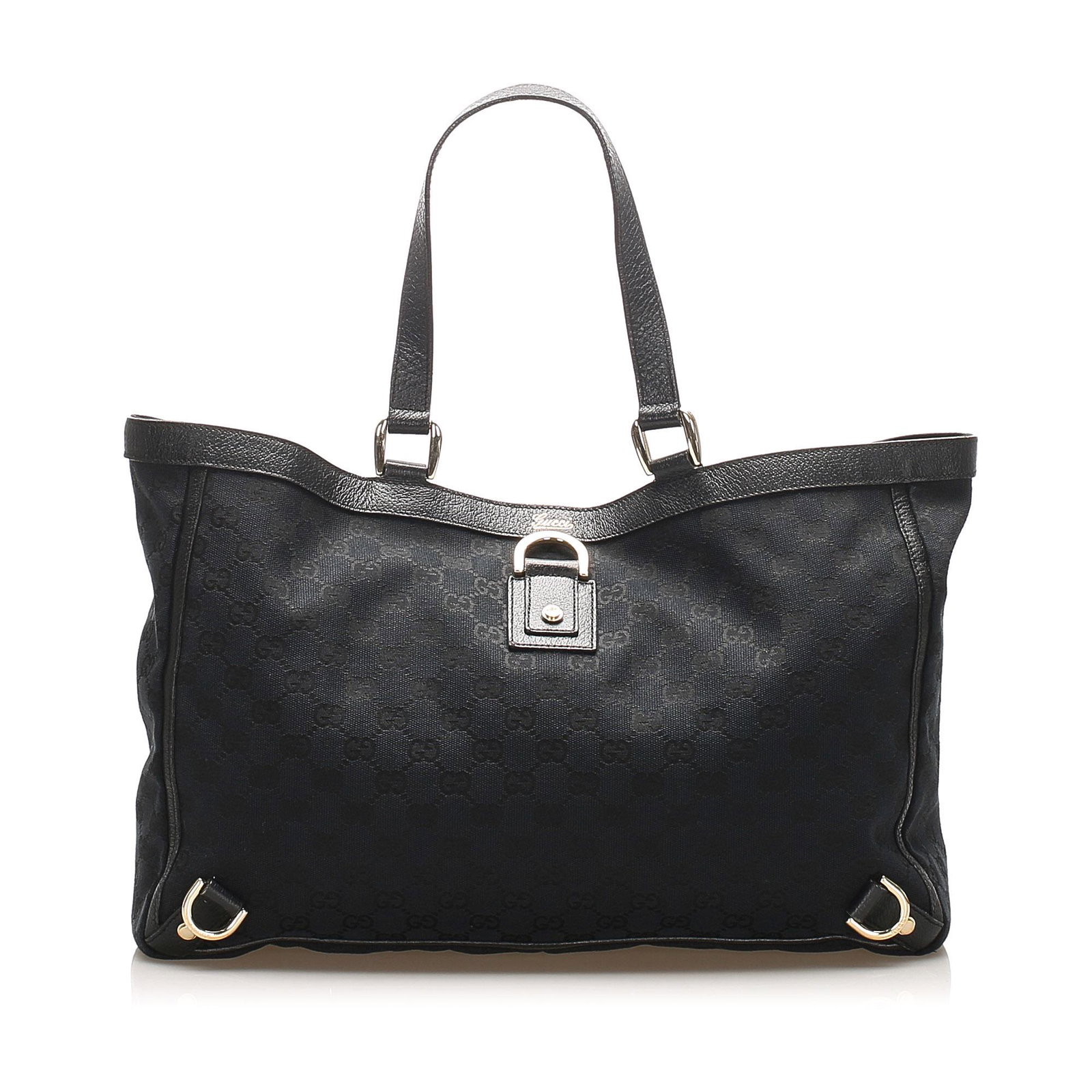 Authentic Gucci GG Canvas Abbey D- Ring Tote Bag: This item qualifies for FREE DOMESTIC SHIPPING to customers in the USA The Abbey D-Ring tote bag features a canvas body with leather trim flat leather straps an open top with a magnetic closure and an