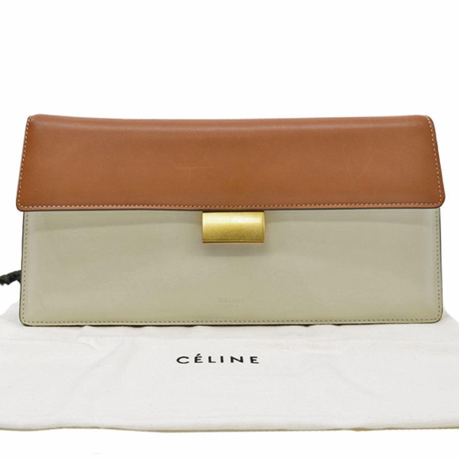 Authentic Celine Bag White Brown Gold Leather Clutch: This item qualifies for FREE DOMESTIC SHIPPING to customers in the USA Brand: Celine Type: Clutch bag Material: Leather ,Metal Color: Brown, White Size (HxWxD): 14cm x 26cm x 4cm / 5.51'' x 10.23'' x