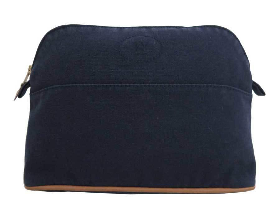Authentic Hermes Pouch Bolide Navy 100% Cotton: This item qualifies for FREE DOMESTIC SHIPPING to customers in the USA Brand: Hermes Type: Pouch Condition: Used (good) Color: Navy Material: Cotton ,100% Damage Ranking: Edges ,Sun damage ,- Size (Hx