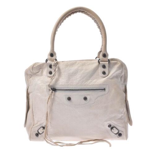 Authentic BALENCIAGA The mini bowling bag Ivory Hand: This item qualifies for FREE DOMESTIC SHIPPING to customers in the USA Brand: BALENCIAGA Style: Hand Bag Material: lambskin Color: Ivory Size: See Description Bag Height: 28cm Bag Depth: 10cm Bag Leng