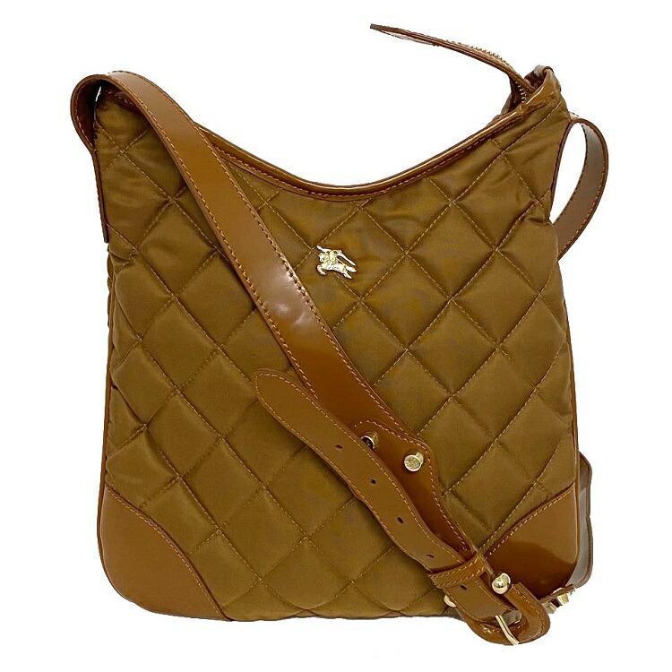 Authentic Burberry Shoulder Bag Camel Quilted Belt: This item qualifies for FREE DOMESTIC SHIPPING to customers in the USA Brand: Burberry Type: Shoulder bag Gender: Women Accessories: Dust bag Condition: Used (very good) Color: Camel Material: Leather