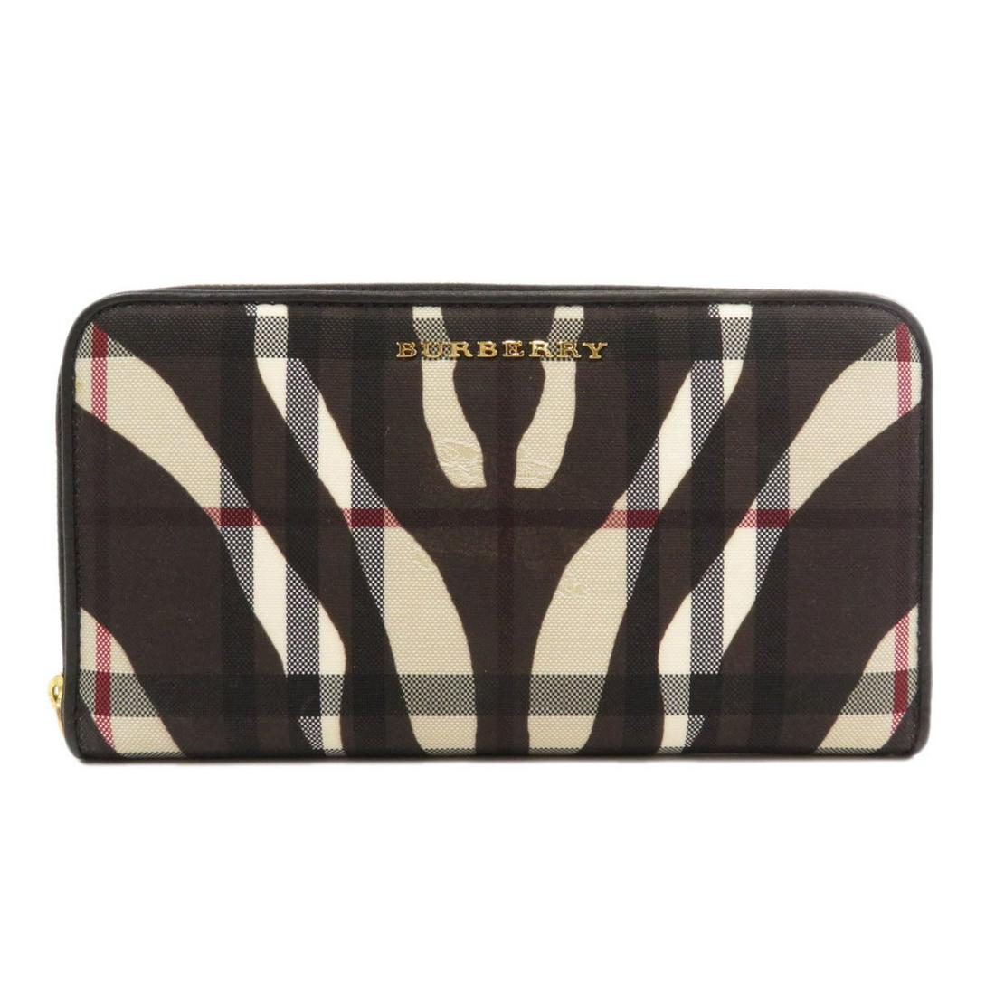Burberry Logo Nova Check Zebra Long Wallet PVC Ladies: Burberry Logo Nova Check Zebra Long Wallet PVC LadiesBrand: Burberry Type: Long wallet (bi-fold) Gender: Women Condition: Used (very good) Material: PVC Color: Brown, Cream Size (HxWxD): 10.5cm x 19cm