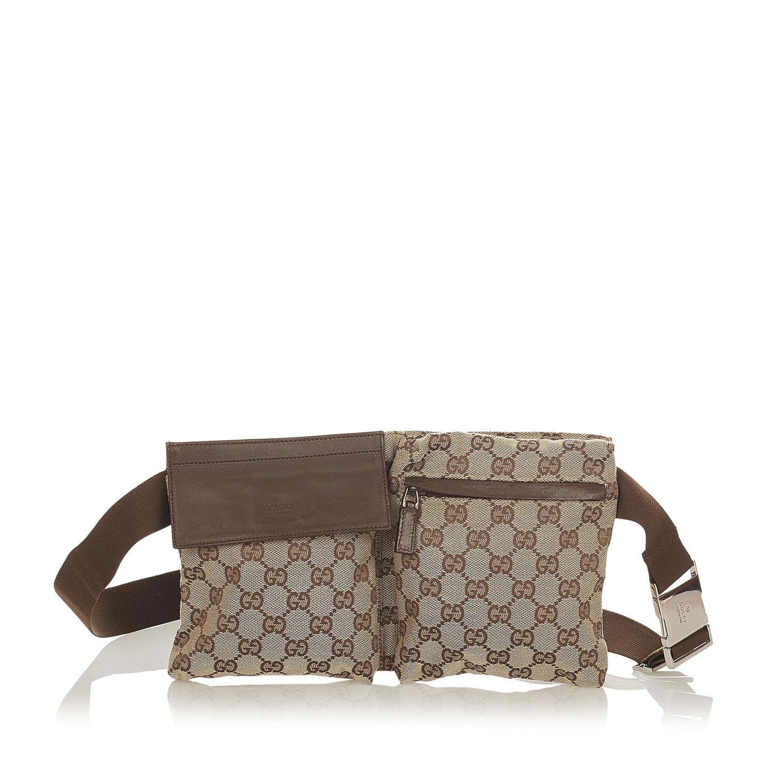 Gucci GG Canvas Belt Bag: Gucci GG Canvas Belt Bag This belt bag features a canvas body with leather trim exterior front flap and zip pockets an exterior back zip pocket and a flat adjustable waist strap. Brand: Gucci Model: G