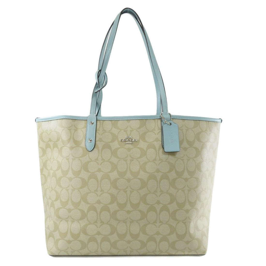 Coach F36658 Reversible Tote Bag PVC Leather Ladies: Coach F36658 Reversible Tote Bag PVC Leather LadiesBrand: Coach Type: Tote bag Gender: Women Accessories: Pouch Condition: Used (very good) Material: PVC Color: Beige, Blue Size (HxWxD): 28cm x 46cm x