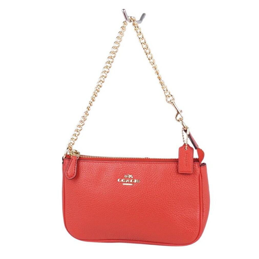 Coach Mini Pouch Women's Leather Red: Coach Mini Pouch Women's Leather RedBrand: Coach Type: Pouch Gender: Women Condition: Used (very good) Color: Red color Size (HxWxD): 12cm x 19cm x 5cm / 4.72'' x 7.48'' x 1.96'' Strap Length: 36cm /