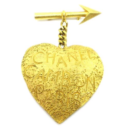 CHANEL CC Logos Bow and arrow Heart Motif Brooch: CHANEL CC Logos Bow and arrow Heart Motif Brooch Gold-Tone Corsage 93A Country/Region of Manufacture: France Material: Gold-tone Theme: Heart Type: Brooch Color: Gold Brand: Chanel Metal: Gold-tone Th