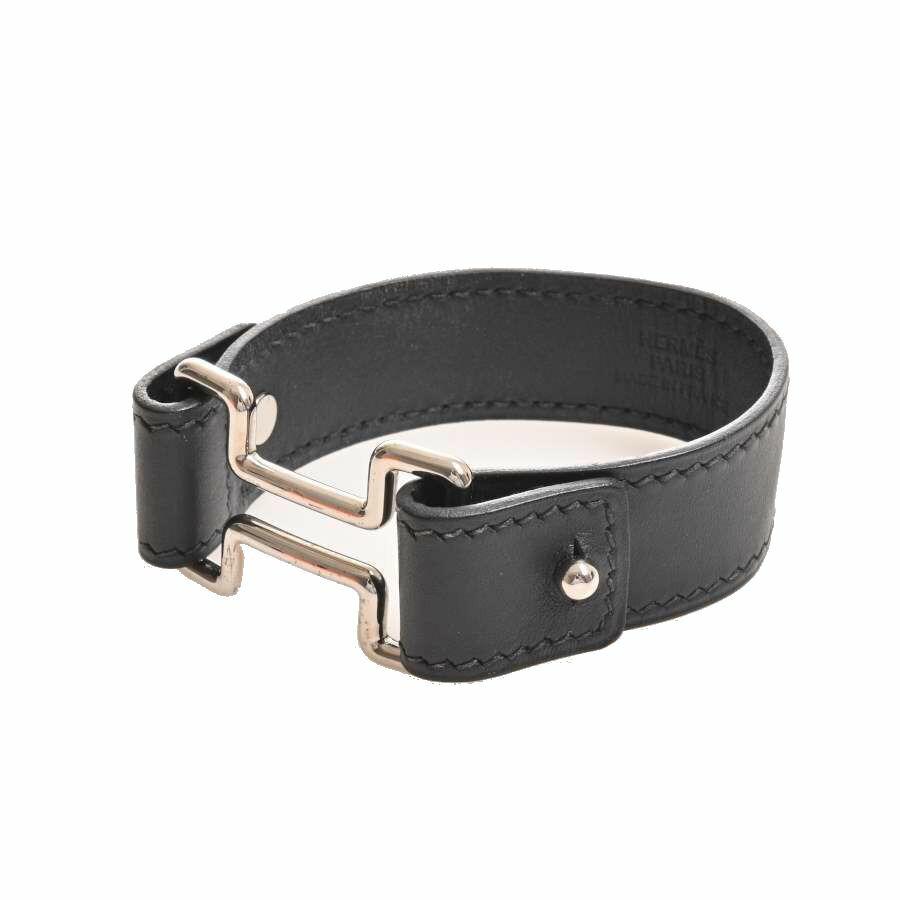 HERMES leather night bracelet black: HERMES leather night bracelet blackBrand: Hermes Type: Charm bracelet Condition: Used (like new) Color: Black Material: Leather Damage Ranking: Overall, Crease, -The Mynt Guarantee:All items in this a
