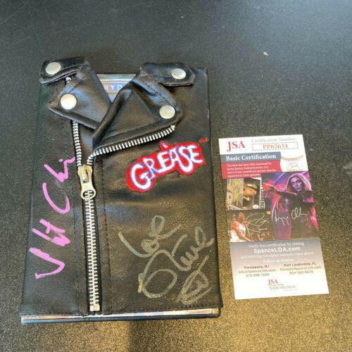 Olivia Newton-John & Stockard Channing Grease Cast: Olivia Newton-John & Stockard Channing Grease Cast Signed DVD Set With JSA Autograph Authentication: James Spence (JSA) Industry: Movies Original/Reproduction: Original PLEASE NOTE: Framed Large or he