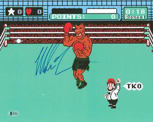 Mike Tyson Signed 11x14 Punch Out Photo BAS Witnessed: Mike Tyson Signed 11x14 Punch Out Photo BAS Witnessed Sport: Boxing Product: Photo Original/Reprint: Original Player: Mike Tyson Autograph Authentication: Beckett PRODUCT_COA: Beckett PRODUCT_SIGNED_B