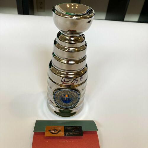 Wayne Gretzky Signed 1996 Mini Stanley Cup Trophy UDA Upper Deck COA: Wayne Gretzky Signed 1996 Mini Stanley Cup Trophy UDA Upper Deck COA Sport: Hockey-NHL Autograph Authentication: Fanatics Authentic Original/Reprint: Original PLEASE NOTE: Framed Large or heavy Items 