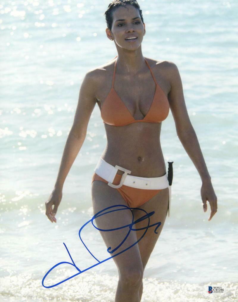 Halle Berry Authentic Autographed 11x14 Photo: Halle Berry Authentic Autographed 11x14 Photo Signature: Halle Berry Product: Autographed 11x14 Photo Featured Movie: James Bond Certificate of Authenticity: Beckett Hologram & Card The Mynt Guarantee