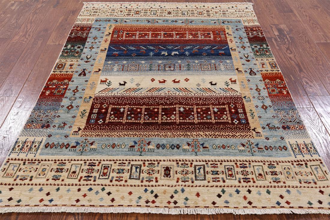 4' 10" X 6' 7" Tribal Persian Gabbeh Hand Knotted Rug: 4' 10" X 6' 7" Tribal Persian Gabbeh Hand Knotted Rug Design: Tribal Exact Size: 4\ 10 X 6\ 7 Style: Super Gabbeh Foundation: Cotton Pile: Wool Weave: Hand-knotted Age: New The Mynt Guarantee: All ite