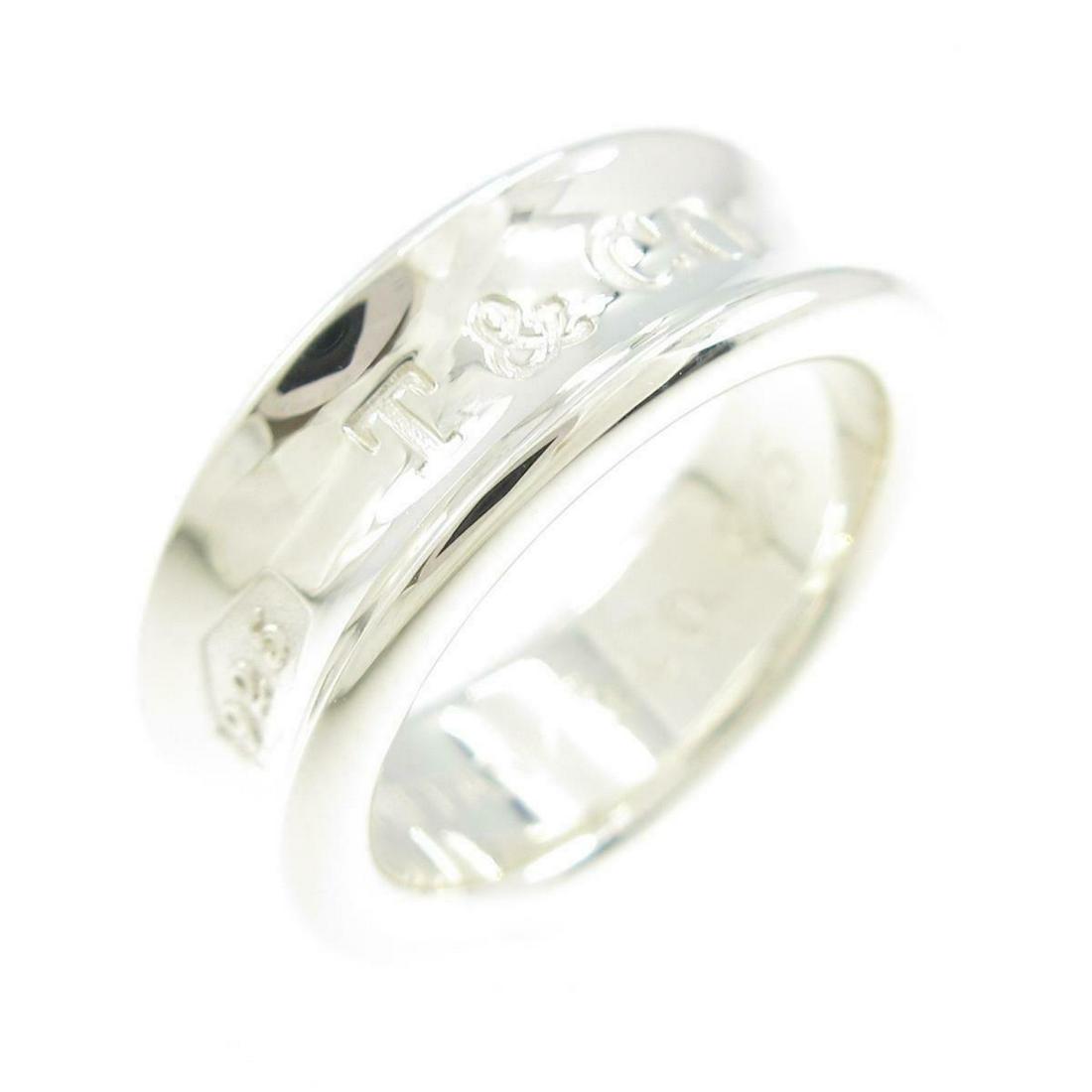 TIFFANY 1837 Ring: TIFFANY 1837 Ring Brand: TIFFANY Style: Ring Material: 925 Gender: Ladies Size: 9.0 (JPN size) Accessories: No case Main Stone: No stones ActualSize: width : 7.0mm Type: Ring Metal: 925 Metal Purity: 