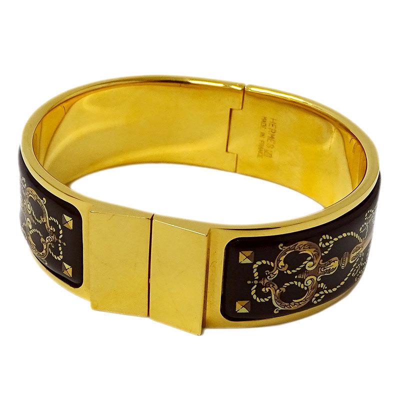 Hermes HERMES Bangle Ladies Cloisonne Grilled Email Brown x Gold: Hermes HERMES Bangle Ladies Cloisonne Grilled Email Brown x Gold Brand: Hermes Country of Origin: France Type: Bangle Gender: Women Color: Brown Gold Diameter: 6cm / 2.36 Width: 2cm / 0.78 Overall Scr