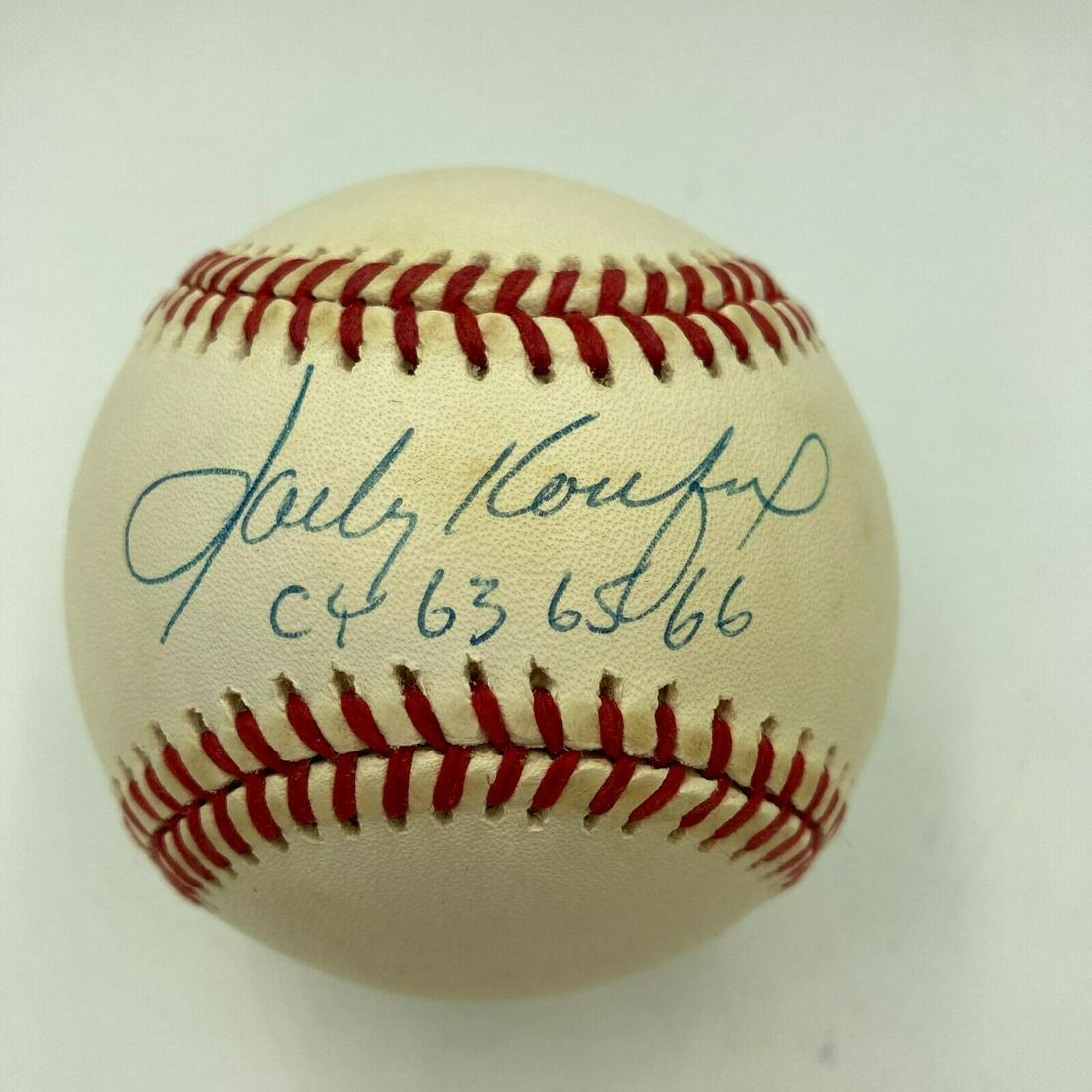 Sandy Koufax Cy Young 1963 1965 1966 Signed Autographed Baseball With JSA COA: Sandy Koufax Cy Young 1963 1965 1966 Signed Autographed Baseball With JSA COA Product: Ball Sport: Baseball-MLB Autograph Authentication: James Spence Authentication (JSA) Original/Reprint: Original P