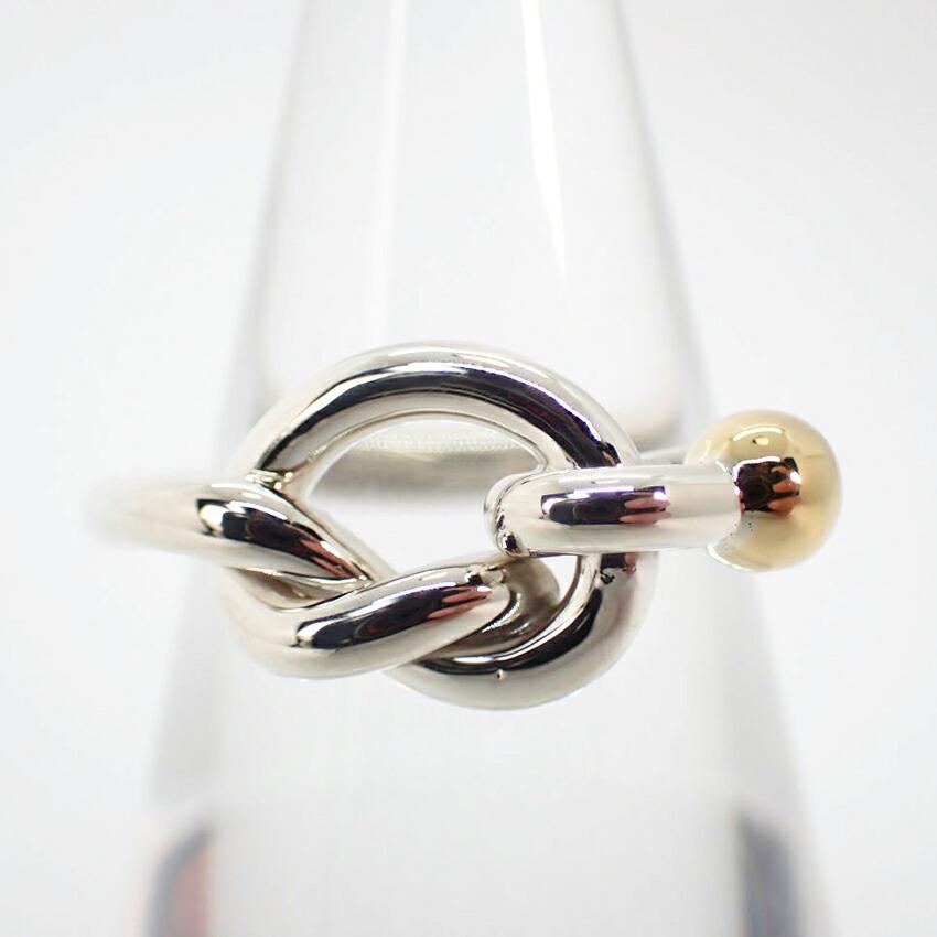 TIFFANY / Tiffany SV925 750 Combi Love Knot Ring No. 7.5: TIFFANY / Tiffany SV925 750 Combi Love Knot Ring No. 7.5 Brand: Tiffany Material: Sterling silver 925 Yellow gold (18K) US Size: 4 Other Size: 47 Width: 8.6mm / 0.34 Weight: 2.9g / 0.1oz. Maintenance: