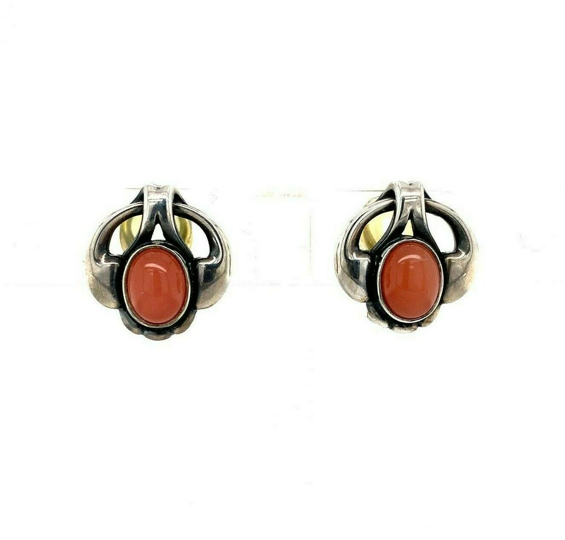 Georg Jensen Sterling 2006 Peach Moonstone Earrings (#J5386): Georg Jensen Sterling 2006 Peach Moonstone Earrings (#J5386) Style: Clip-On Base Metal: Sterling Silver Certification: GIA Material: Metal Type: Earrings Main Stone Color: Peach Color: Multicolor Year