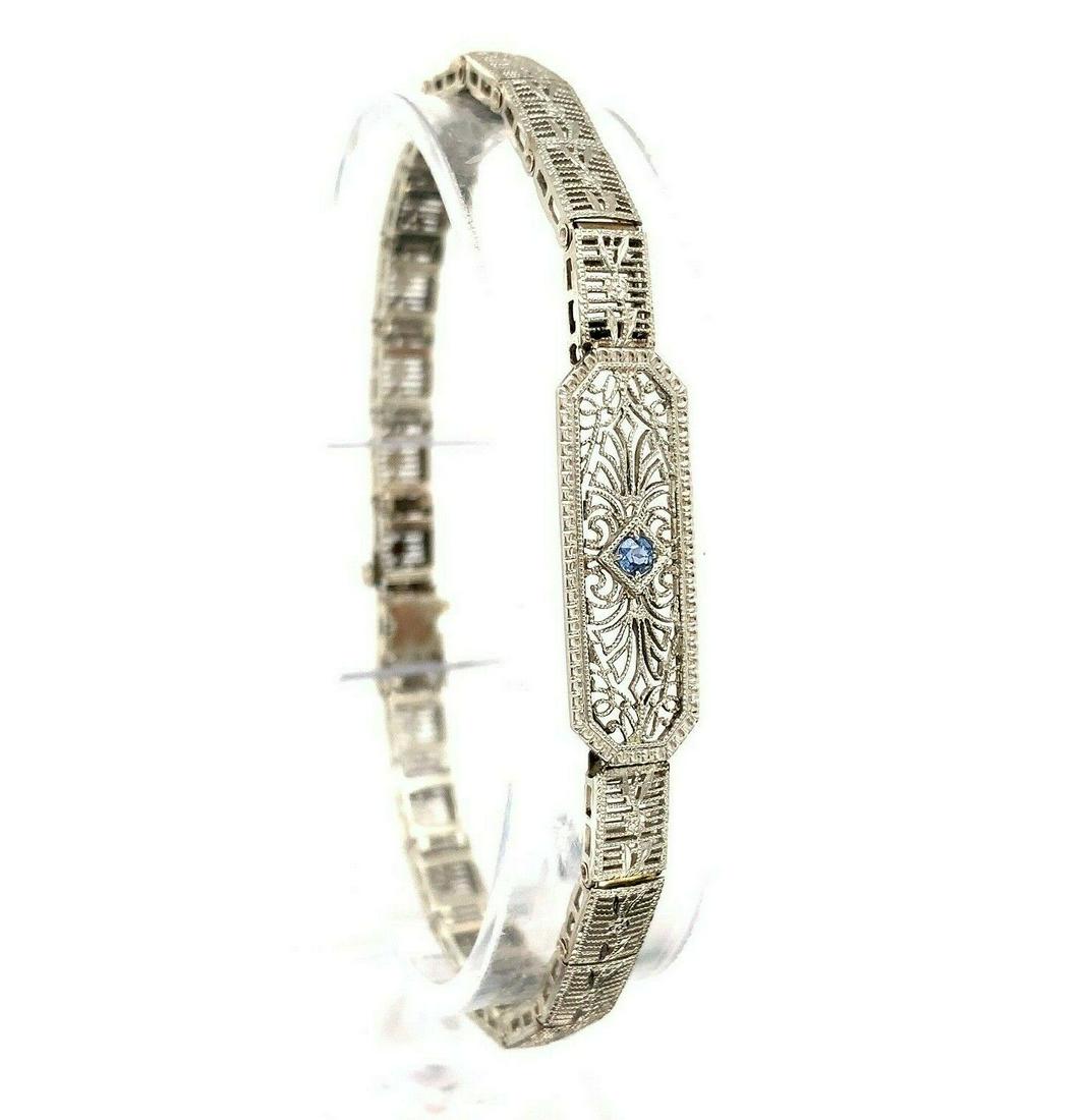 10k White Gold Art Deco Genuine Natural Sapphire Filigree Bracelet (#J5535): 10k White Gold Art Deco Genuine Natural Sapphire Filigree Bracelet (#J5535) Style: Filigree Base Metal: White Gold Certification: GIA Material: Metal Number Of Gemstones: 1 Type: Bracelet Main Stone C