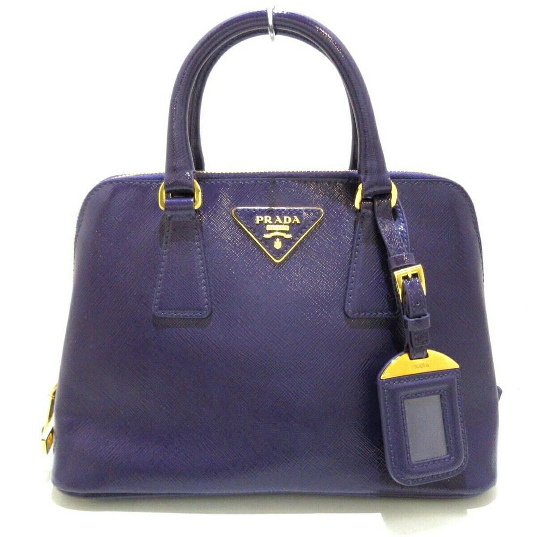PRADA BL0838 Purple Saffiano Vernis Leather Womens: PRADA BL0838 Purple Saffiano Vernis Leather Womens Brand: PRADA Style: Handbag Exterior Color: Purple Exterior Material: Saffiano Vernis Leather Model Number: BL0838 Accessories: Dust Bag Guarantee Sh