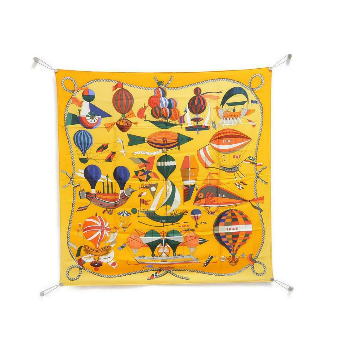 HERMES Scarf: HERMES Scarf Brand: HERMES Style: Scarf Color: ORANGE+JAUNE Material: Silk Gender: Ladies Size: W x H : 90cm x 90cm Type: Scarf AB: Very Good The Mynt Guarantee: All items in this auction are guarante