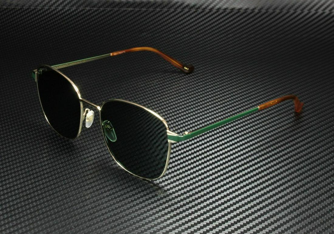 GUCCI GG0575SK 004 Round Oval Gold Green Men's Sunglasses 56 mm: GUCCI GG0575SK 004 Round Oval Gold Green Men's Sunglasses 56 mm Brand: Gucci Type: Sunglasses Frame Color: Gold Style: Square Lens Color: Green Theme: Metal Frame Material: Acetate Lens Material: Plas