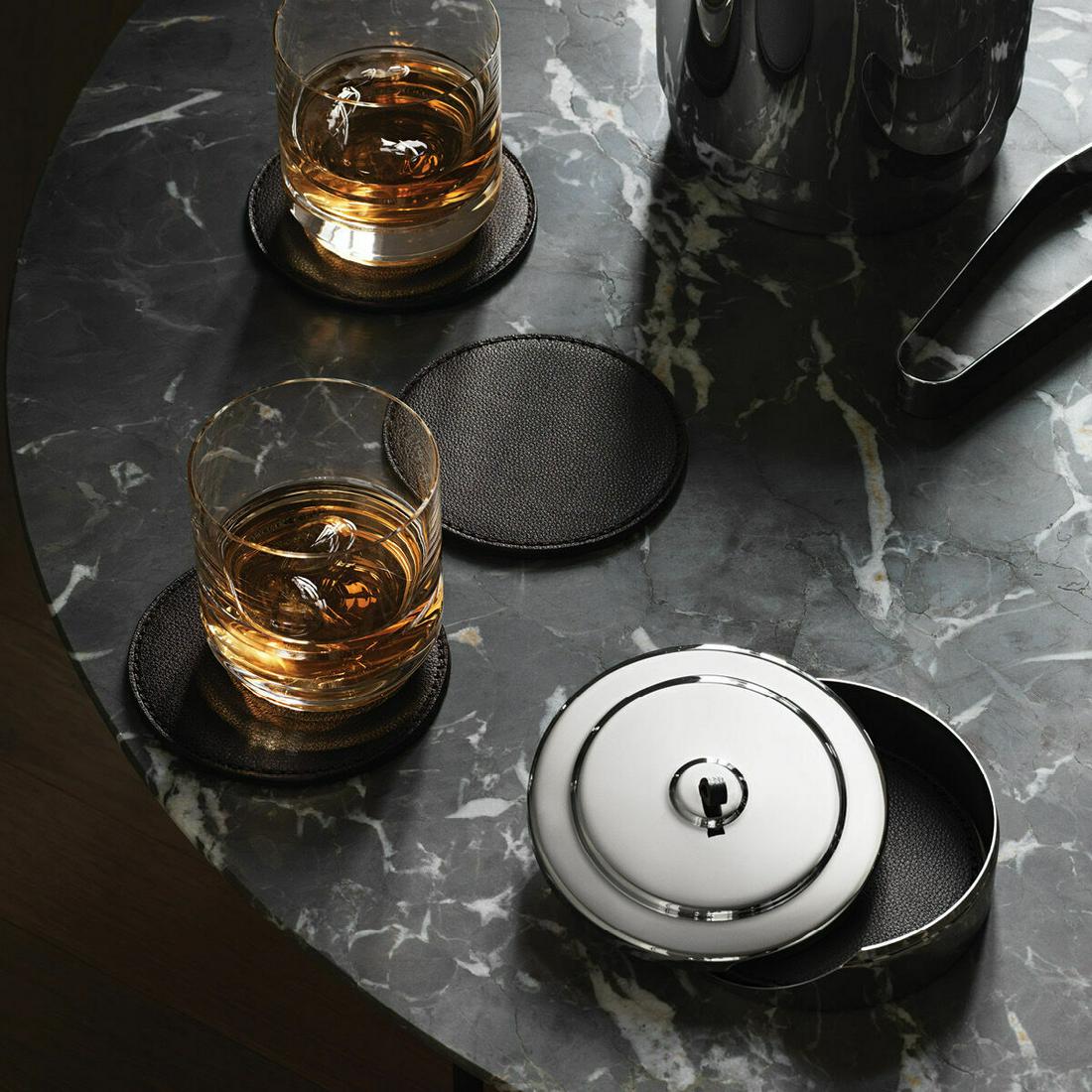 Manhattan by Georg Jensen Stainless Steel and Leather Coaster Set - New: Manhattan by Georg Jensen Stainless Steel and Leather Coaster Set - New Bringing a little of the glamour and sophistication of gatsby-era new york, this set of leather coasters in a stainless steel ca