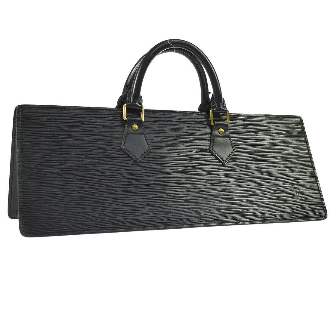 LOUIS VUITTON SAC TRIANGLE HAND BAG BLACK EPI LEATHER M52092: LOUIS VUITTON SAC TRIANGLE HAND BAG BLACK EPI LEATHER M52092 Size: Medium Style: Hand Bag Bag Height: 5.9 Exterior Color: Black Exterior Material: Epi Leather Leather Closure: Zip Brand: Louis Vuitton