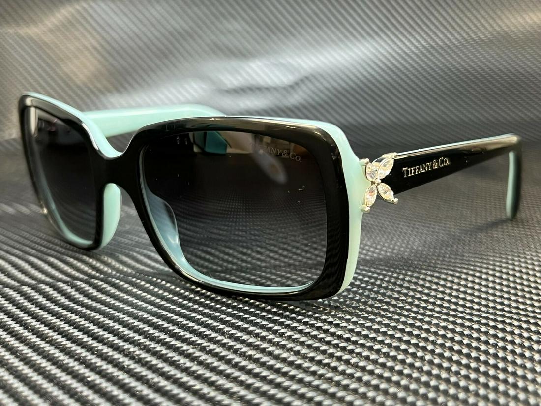 TIFFANY TF4047B 80553C Black Grey Gradient Women's Sunglasses 55 mm: TIFFANY TF4047B 80553C Black Grey Gradient Women's Sunglasses 55 mm Brand: Tiffany & Co. Frame Color: Black Blue Type: Sunglasses Uv Protection: Uv Protection Model: TF4047B Style: Rectangle Frame Mat