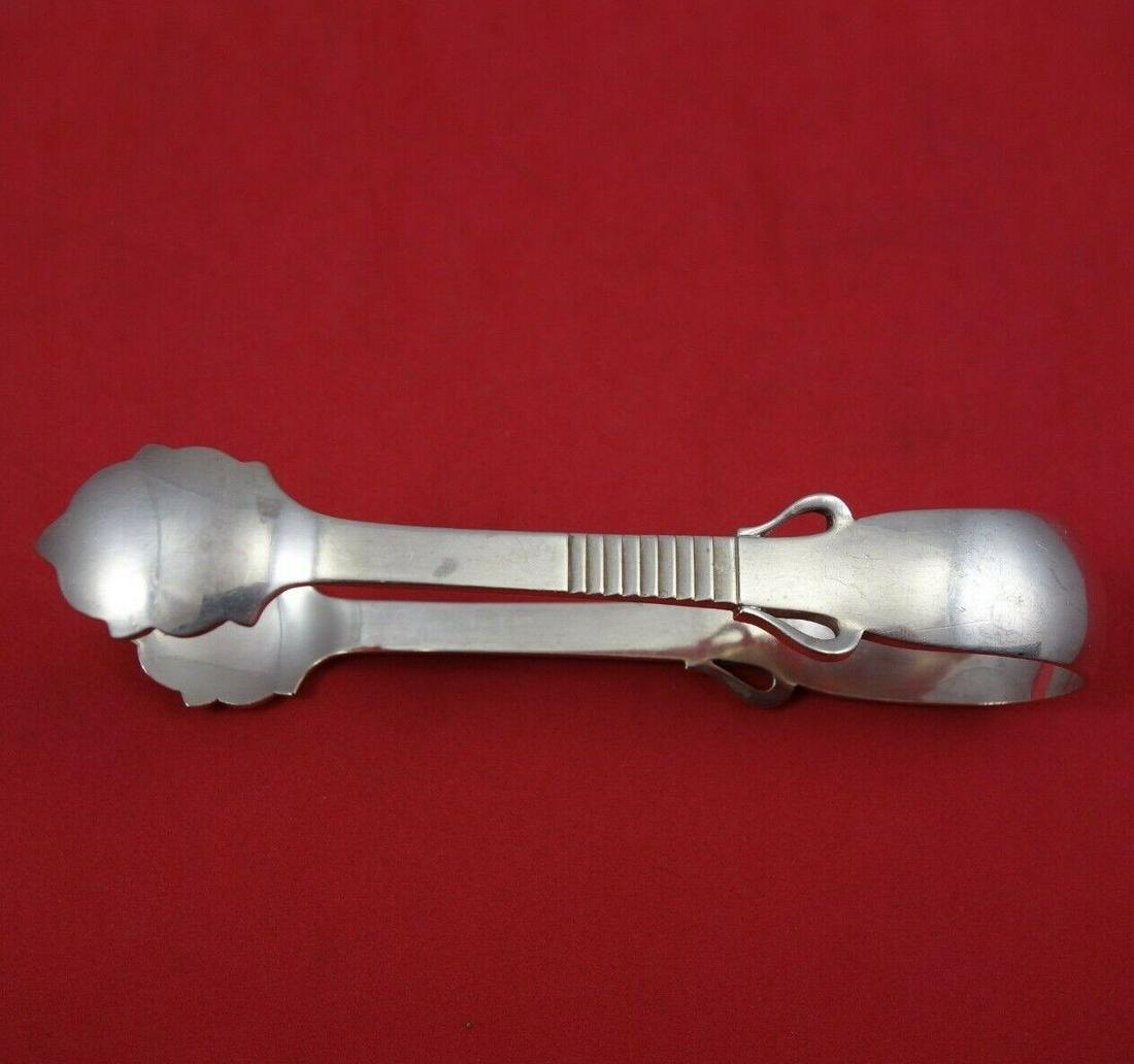 Parallel by Georg Jensen Sterling Silver Ice Tong GI Mark w/ Wings 4 5/8": Parallel by Georg Jensen Sterling Silver Ice Tong GI Mark w/ Wings 4 5/8" Parallel by georg jensen sterling silver ice tong with gi mark with wings 4 5/8" in the pattern parallel by georg jensen. It i