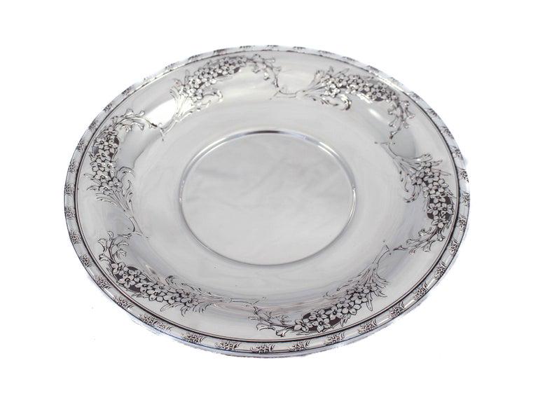 Sterling "Larkspur" Dessert Tray: Sterling "Larkspur" Dessert Tray Creator:: Wallace Silversmiths (Manufacturer) Dimensions:: Height: 1 in (2.54 cm) Dimensions:: Diameter: 10 in (25.4 cm) Materials and Techniques:: Sterling Silver Pla