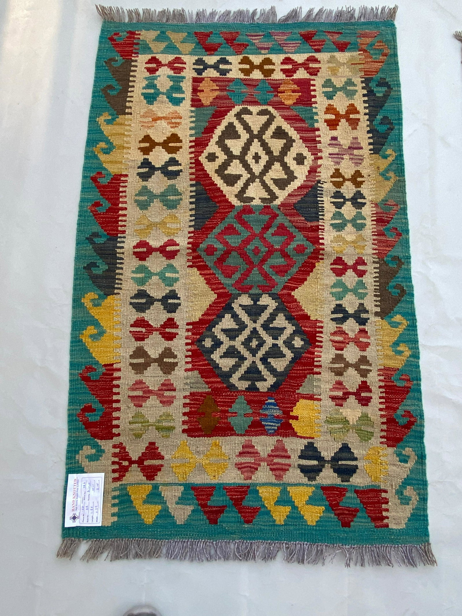 2' x 4' Multi-Color Red Kilim Rug: 2' x 4' Multi-Color Red Kilim Rug Size in Feet: Width: 2 x Length: 4 Size in Inches: Width: 24 in x Length: 48 in Colors: MultiColor Red Navy Blue Ivory Weave: 100% Handmade Style: Tribal Origin: Afgh