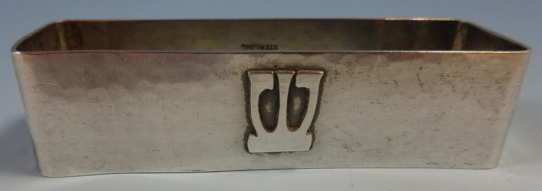 Lebolt Sterling Silver Napkin Ring with Monogram "W": Lebolt Sterling Silver Napkin Ring with Monogram "W" Lebolthand made lebolt sterling silver napkin ring with an applied "w" monogram (see photo). It was retailed by hyman & co. The piece measures 3" x