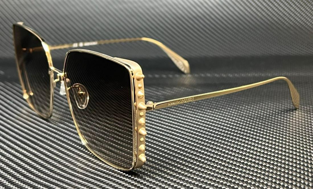 ALEXANDER MCQUEEN AM0309S 002 Gold Brown Gradient Women's 62 mm Sunglasses: ALEXANDER MCQUEEN AM0309S 002 Gold Brown Gradient Women's 62 mm Sunglasses Frame Color: Gold Type: Sunglasses New The Mynt Guarantee: All items in this auction are guaranteed to be 100% authentic. At 