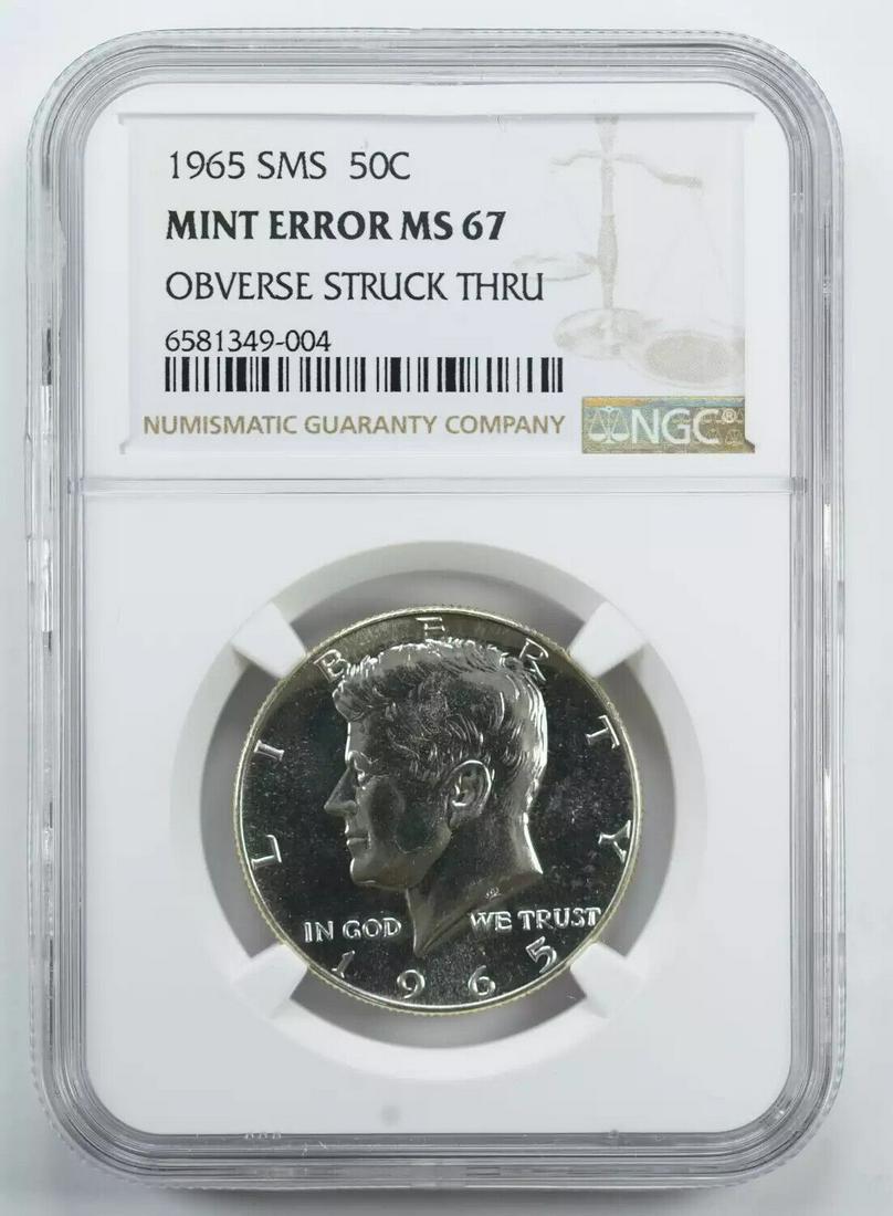 1965 SMS KENNEDY HALF DOLLAR 50C NGC MS 67 UNC - ERROR OBV STRUCK THRU (004): 1965 SMS KENNEDY HALF DOLLAR 50C NGC MS 67 UNC - ERROR OBV STRUCK THRU (004) Certification: NGC Composition: Silver Grade: MS-67 Year: 1965 Circulated/Uncirculated: Uncirculated Strike Type: MS Mint L