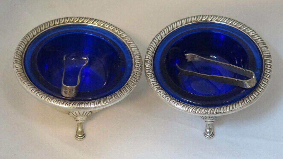 Vintage Sterling Silver Salts pair: Vintage Sterling Silver Salts pair Material: Sterling Silver Type: Open Salt Color: silver/purple This vintage pair of sterling silver salt cellars date from the 1930's. They are designed with a decor