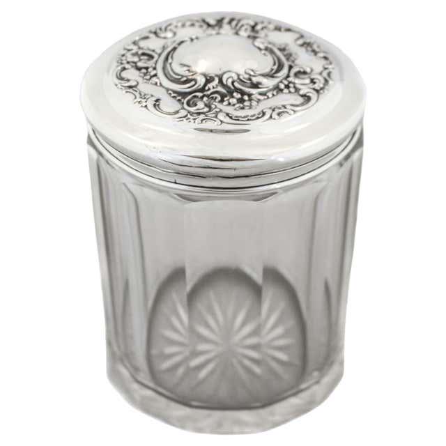 Sterling and Crystal Vanity Jar: Sterling and Crystal Vanity Jar Creator: Wallace Silversmiths (Manufacturer) Dimensions: Height: 5 in (12.7 cm)Diameter: 4 in (10.16 cm) Materials and Techniques: Crystal Sterling Silver Place of Orig