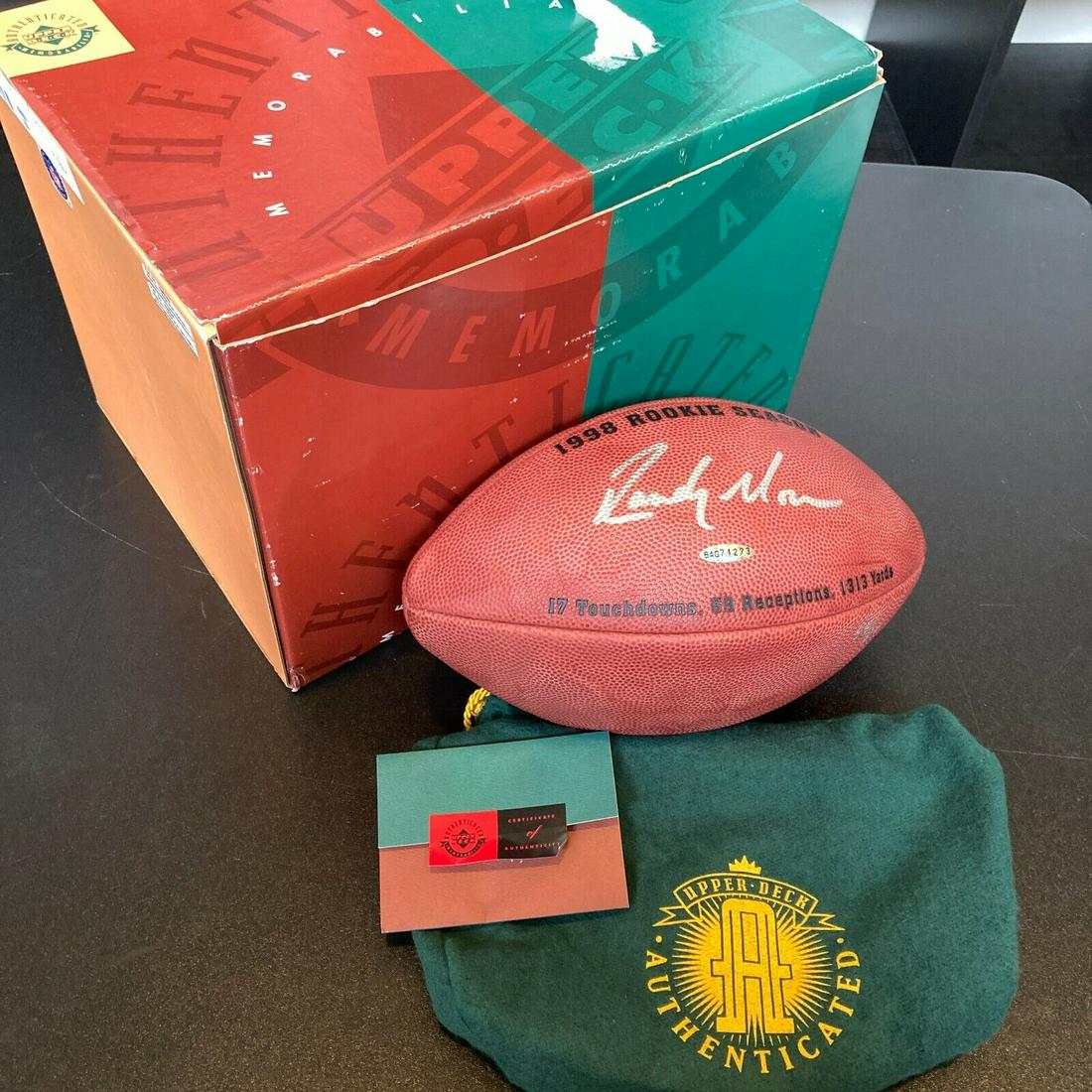 Randy Moss 1998 Rookie Signed Wilson NFL Game Football #44/84 UDA Upper Deck COA: Randy Moss 1998 Rookie Signed Wilson NFL Game Football #44/84 UDA Upper Deck COA Sport: Football-NFL Player: Randy Moss Autograph Authentication: Upper Deck Original/Reprint: Original Product: Ball Pr