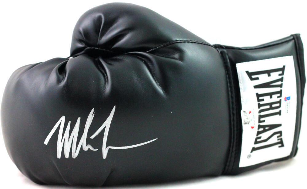Mike Tyson Autographed Black Everlast Boxing Glove -Beckett *Left: Mike Tyson Autographed Black Everlast Boxing Glove -Beckett *Left Sport: Boxing Product: Glove Original/Reprint: Original Player: Mike Tyson Autograph Authentication: Beckett Signed: Yes Pre-Owned PLE