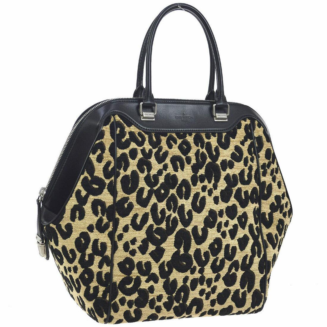 LOUIS VUITTON North South 2012-13 Handbag Monogram Leopard M94258: LOUIS VUITTON North South 2012-13 Handbag Monogram Leopard M94258 Size: Large Style: Hand Tote Bag Bag Height: 14.2 Exterior Color: Black Beige Exterior Material: Leopard jacquard Leather Strap Drop: 