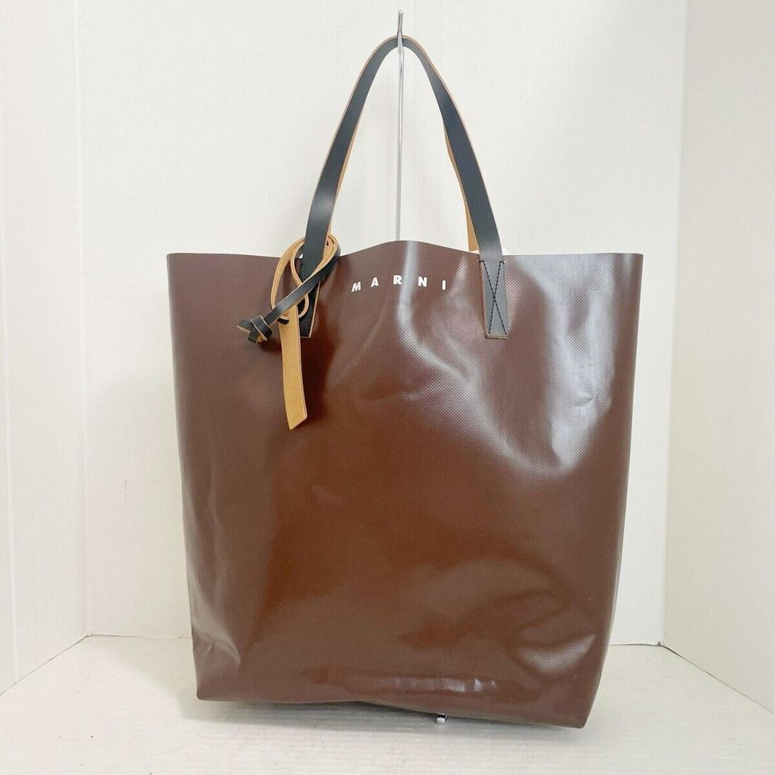 MARNI - SHMQ0000A9 Brown Cream Black Polyester Leather Tote Bag: MARNI - SHMQ0000A9 Brown Cream Black Polyester Leather Tote Bag Style: Tote Bag Exterior Color: Brown Cream Black Exterior Material: Polyester Leather Accessories: Dust Bag Charm Tag Type: Tote Bag B: