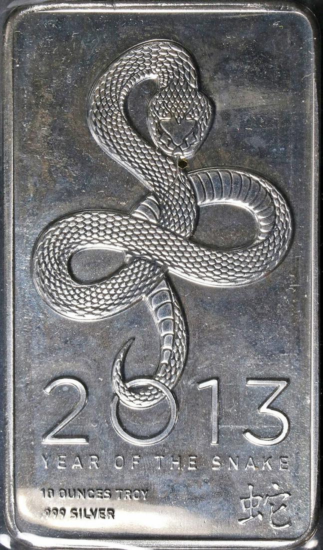 2013 Year of the Snake Lunar 10 Ounce Silver Bar 999 Fine - NTR (New) - STOCK: 2013 Year of the Snake Lunar 10 Ounce Silver Bar 999 Fine - NTR (New) - STOCK Composition: Silver Year: 2013 Pre-Owned The MYNT Guarantee: All items in this auction are guaranteed to be 100% authentic