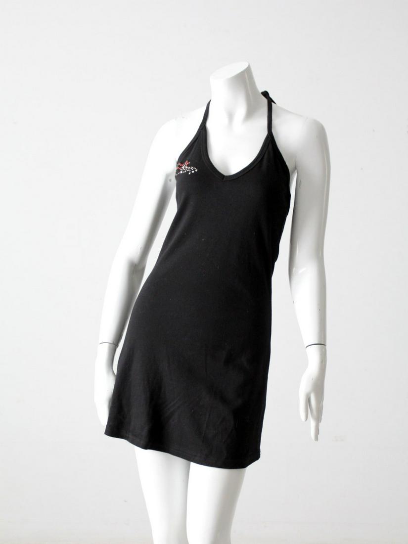 Anna Sui Vintage Dress: Anna Sui Vintage Dress This is a 1990s vintage Anna Sui dress. The black cotton halter dress falls above the knee. Red rhinestone beaded lips blow a kiss of silver sequin stars on the right chest. A c